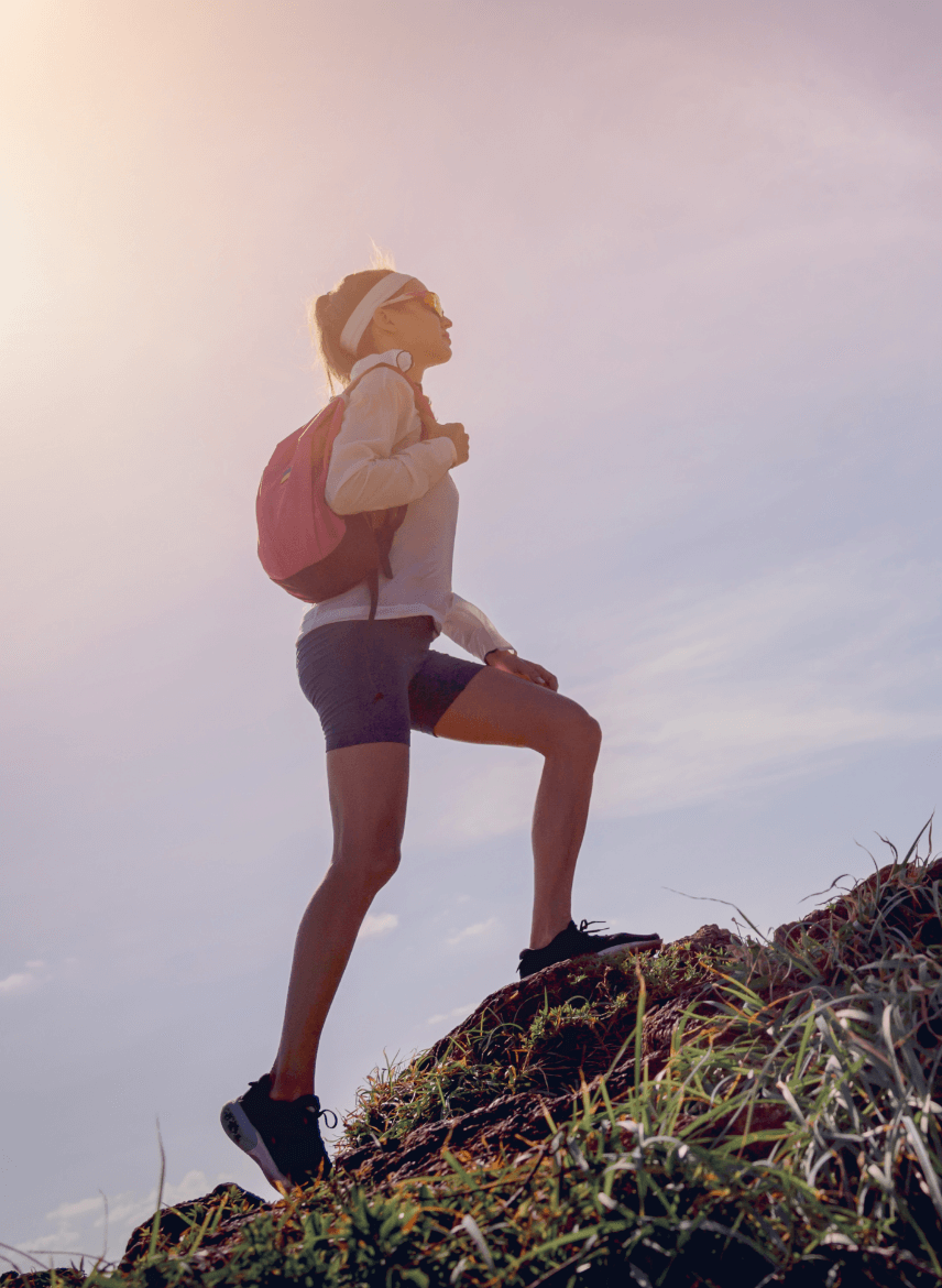 young-woman-climbs-top-mountains-near-ocean